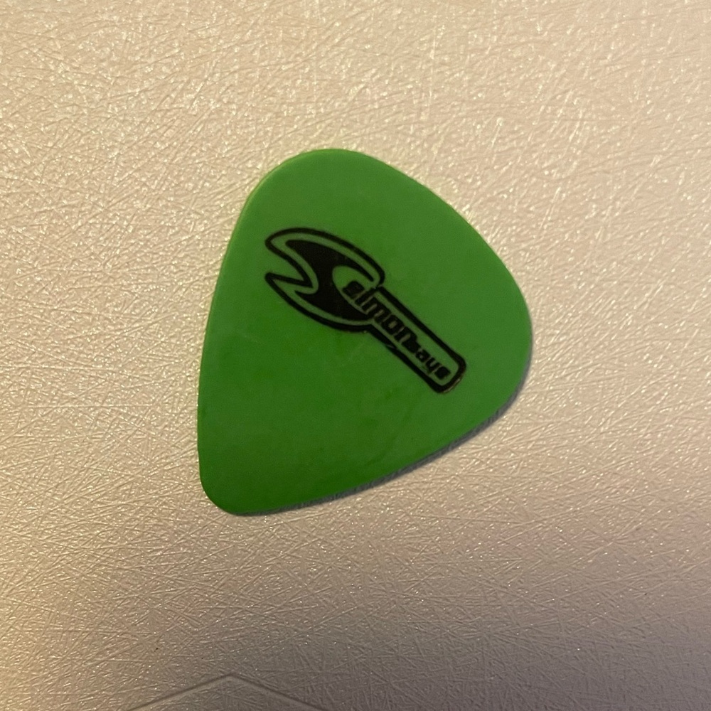 Simon Says 1999 Tour Dunlop has Green Guitar Pick